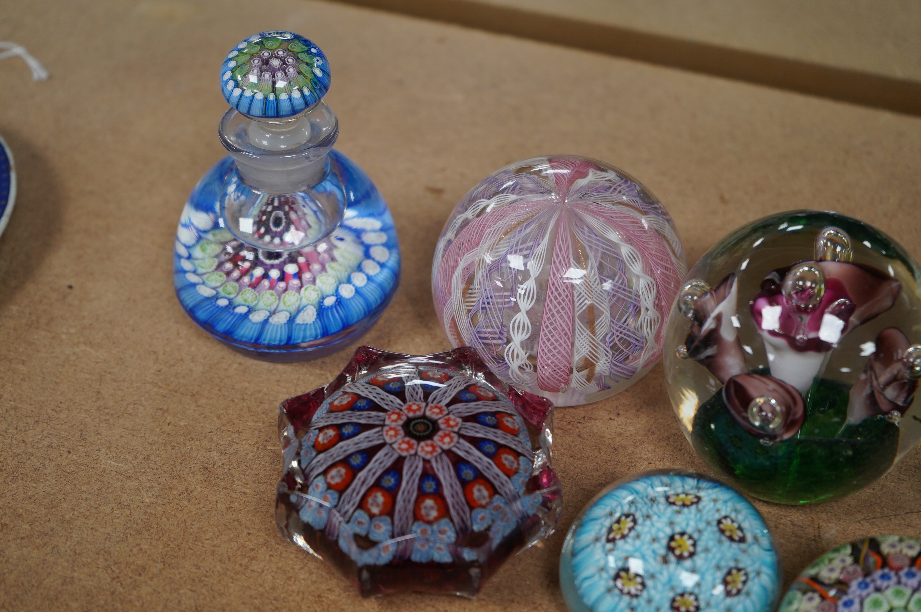 A group of ten paperweights including a ‘scent bottle’ paperweight, 9.5cm. Condition - fair to good